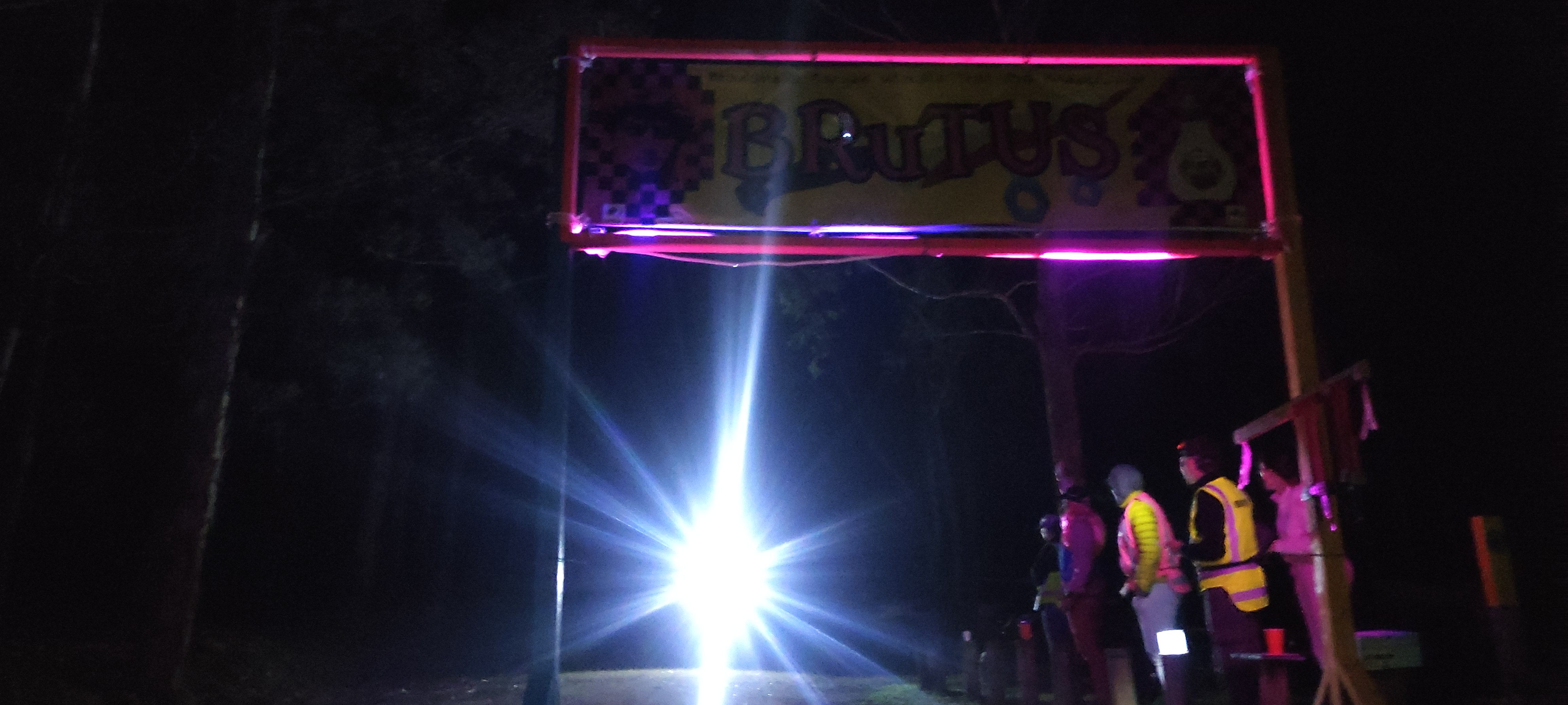 A finisher arrives at the end of the BTrail 100km
